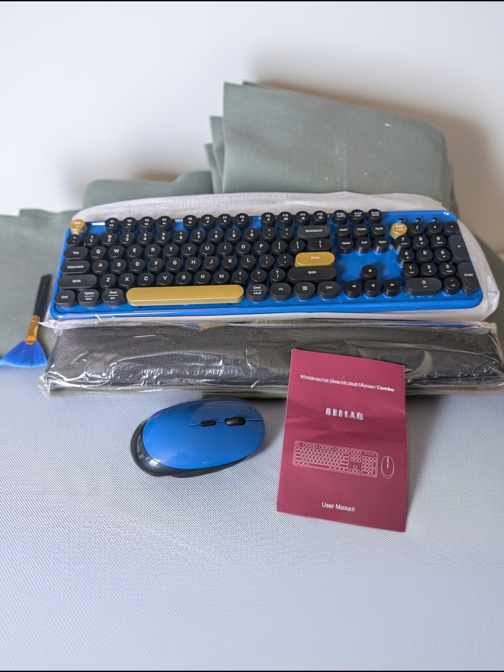 wireless keyboard and mouse combo featuring a blue and black retro typewriter.
